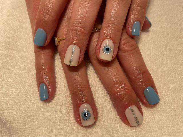 Elegant Soft Blue and White Nail Design with Glitter Accents