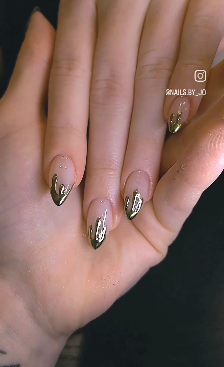 Chic Elegant Nail Design: Nude Base with Wavy Gold Metallic Tips and Dot Accents.