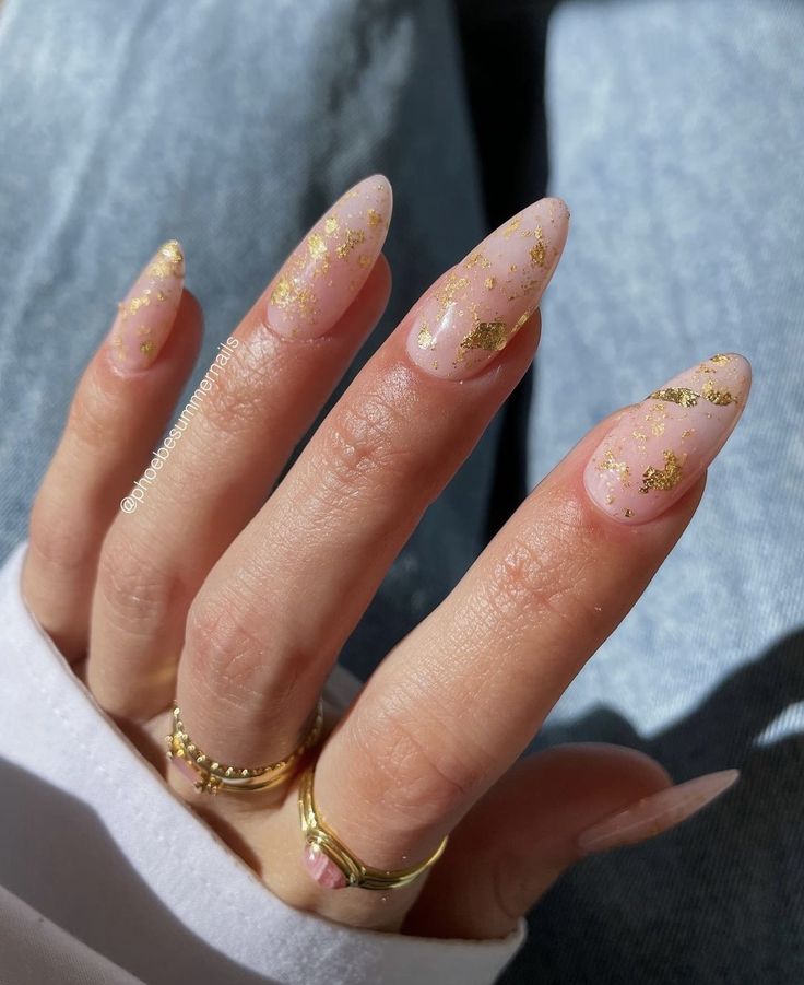 Chic Stiletto Nails: Soft Pink Base with Glamorous Gold Flakes Perfect for Any Occasion