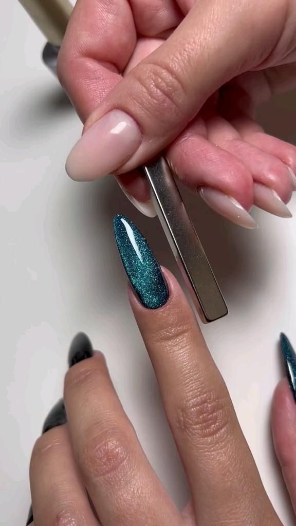 Striking Gradient Shimmer Nail Design with Teal Glitter and Nude Polish.