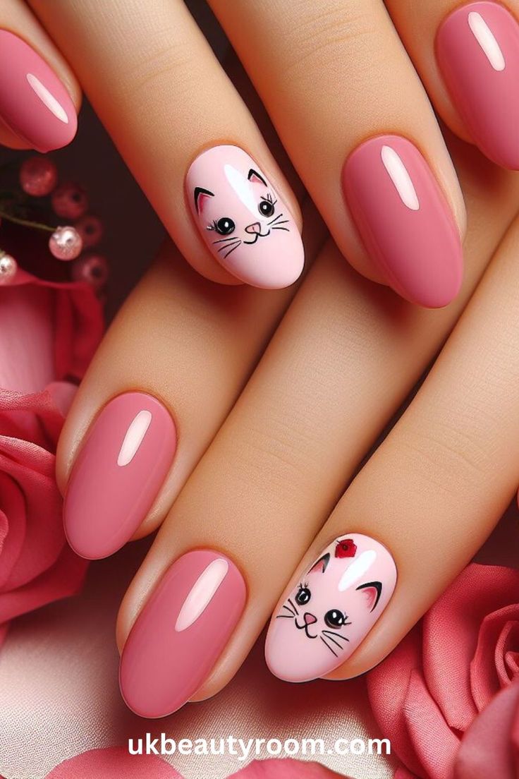 Whimsical Cat Motif Nail Design in Soft Pink and Vibrant Rose Shades