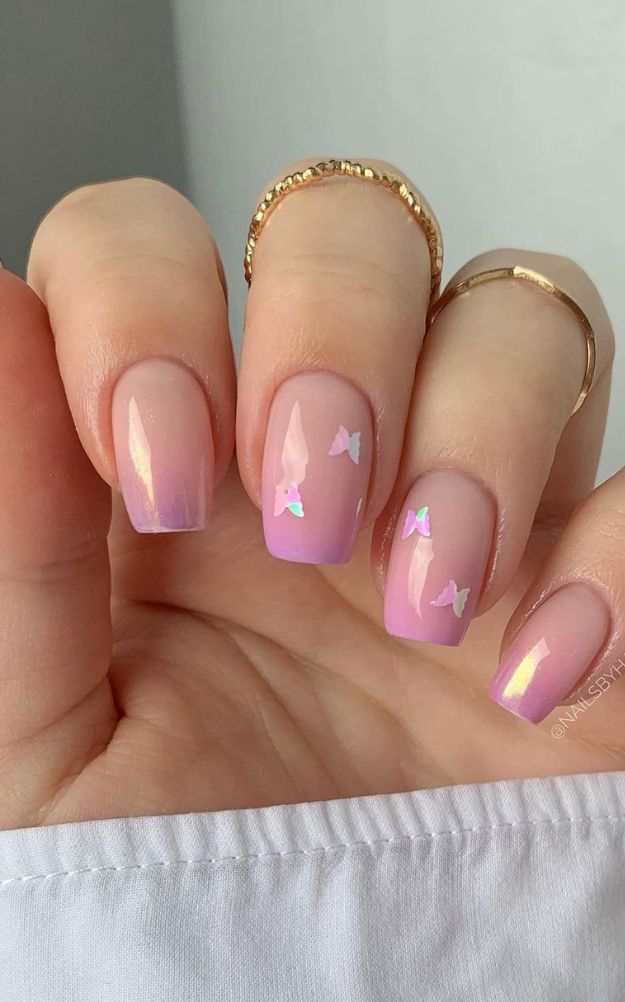 Charming Pink Ombre Nail Design with Iridescent Butterfly Accents