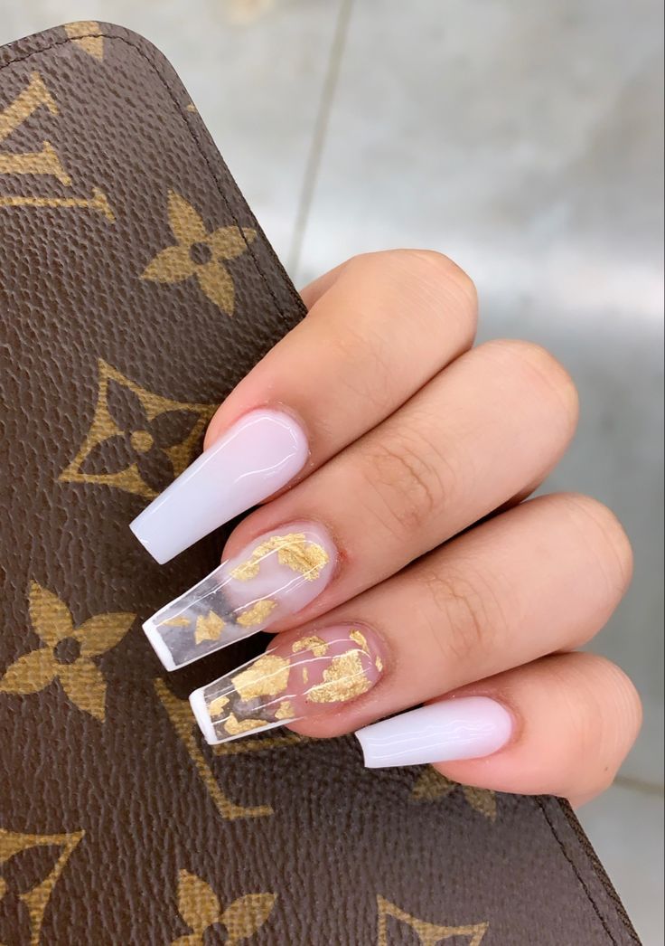 Chic Elegant Nail Design: Glossy White Tips with Gold Leaf Accent.