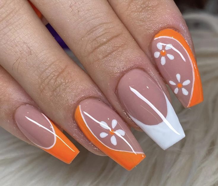 Playful Summer Nail Design: Whimsical Floral Patterns in Nude, Orange, and White.