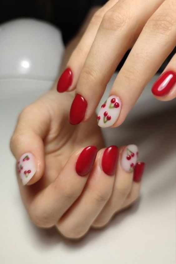 Charming Cherry-Themed Oval Nail Design: A Perfect Blend of Boldness and Delicacy.