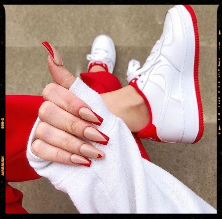 Trendy Almond-Shaped Chic Red and Nude Nail Design: Perfect Match for Casual Athleisure Style.