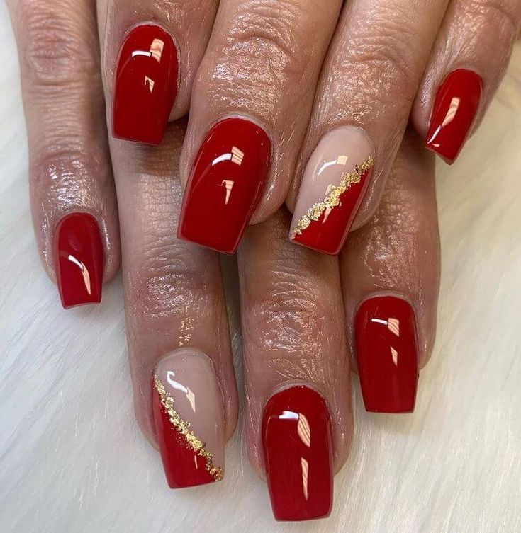 Sophisticated Nail Design: Bold Red and Soft Nude with Gold Accents