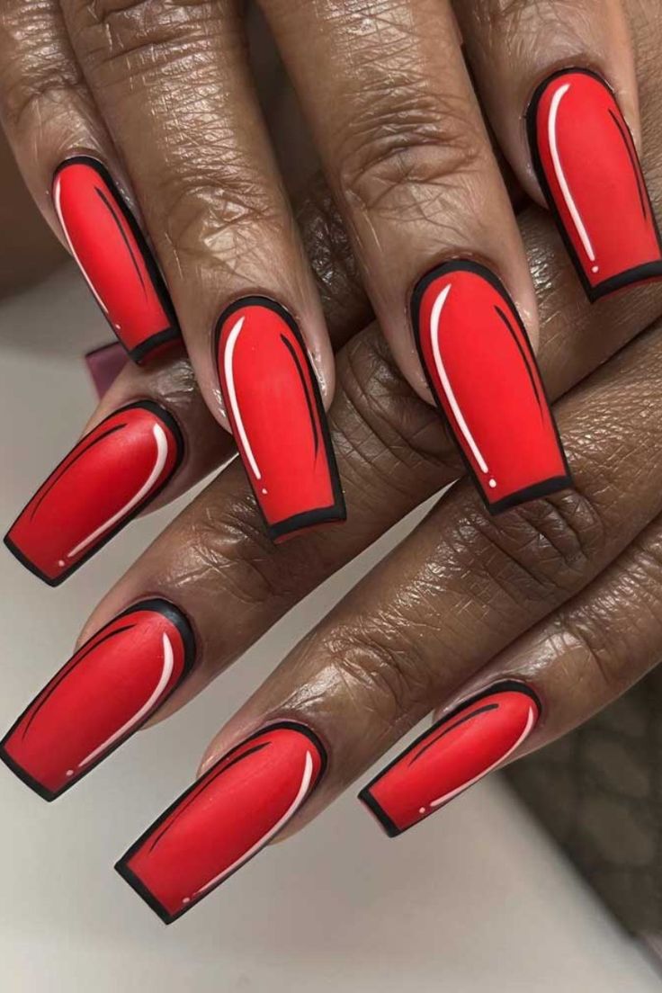 Striking Bold Red Nails with Geometric Designs and Elegant Accents.