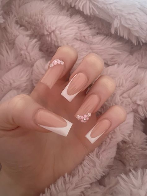 Sophisticated Nude Nail Art with White Tips and Charming Pink Embellishments