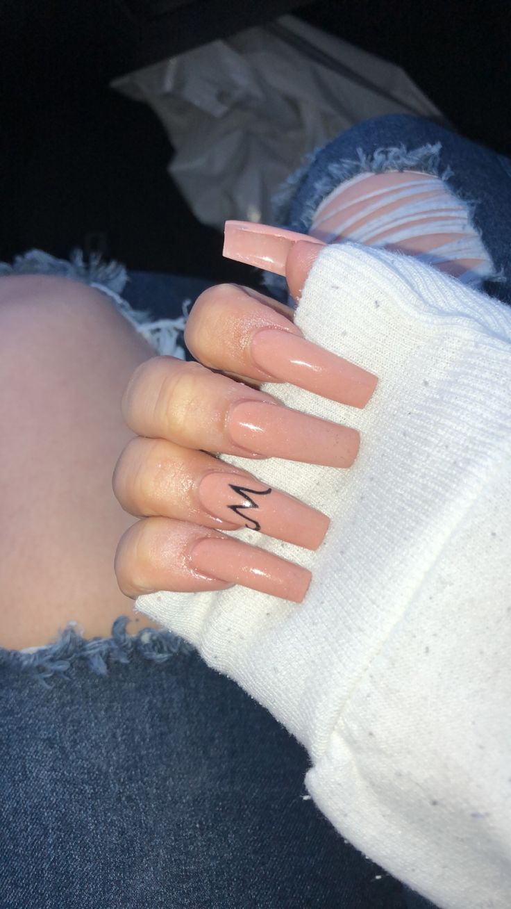 Elegant Chic Nude Nails with Modern Black Line Design for a Stylish Touch.