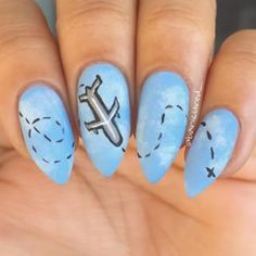 Aviation-Inspired Sky Gradient Nail Design with Airplane and Flight Path Accents.