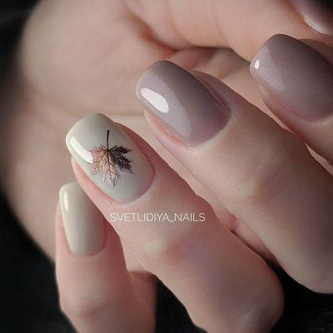 Autumn-Inspired Nail Design: Soft Beige & Taupe with Delicate Leaf Print.