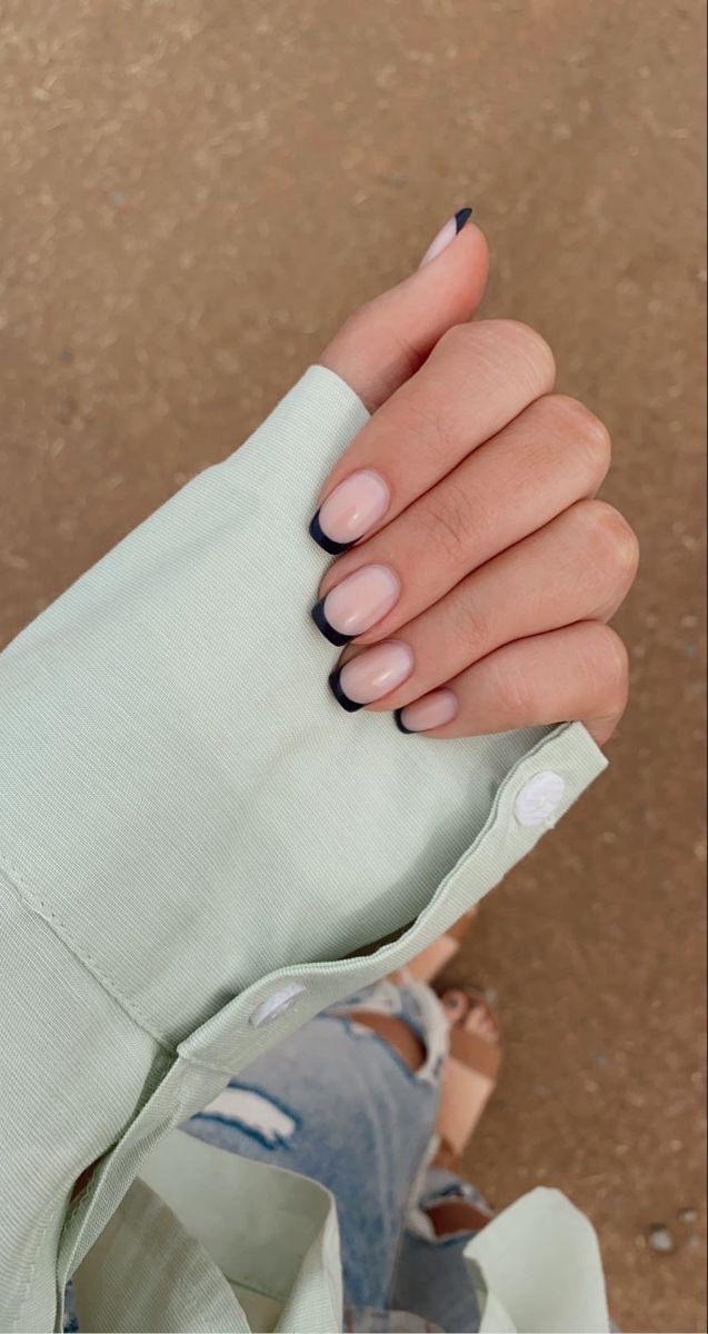 Sophisticated Nude and Black Tip Manicure: A Chic Blend for Any Occasion.