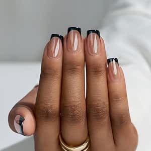 Chic Neutral Base with Bold Black French Tips for a Timeless Manicure.