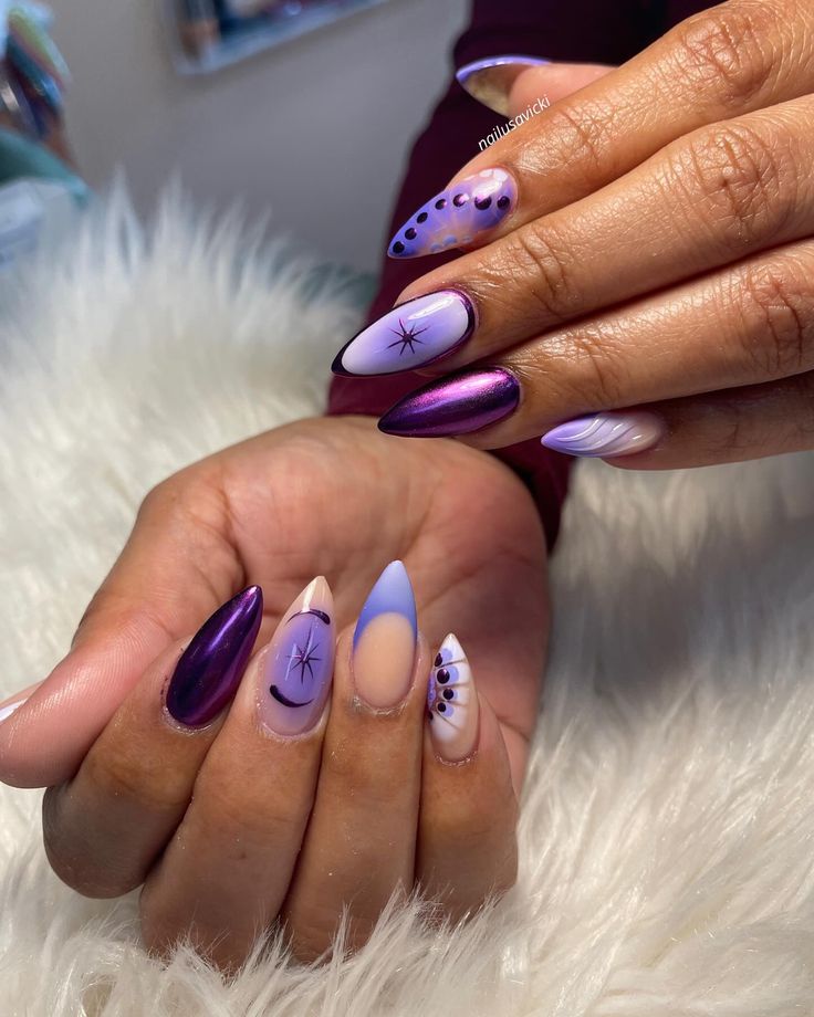 Bold and Artistic Nail Design in Striking Purple and Lavender Shades.