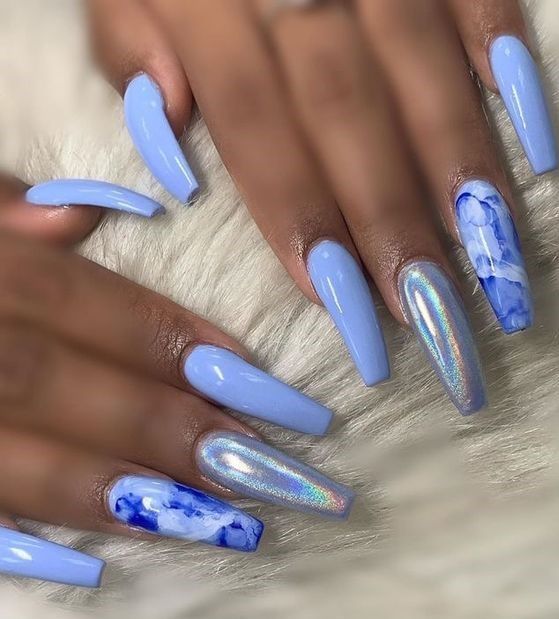 Elegant Pastel Blue Long Nails with Holographic Accents and Artistic Marbling.