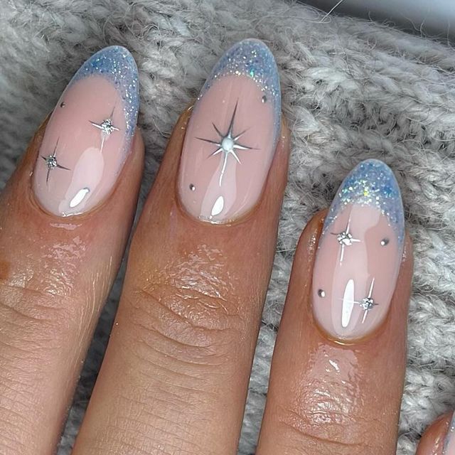 Celestial-Inspired Elegant Nude Nail Design with Silver and Blue Accents