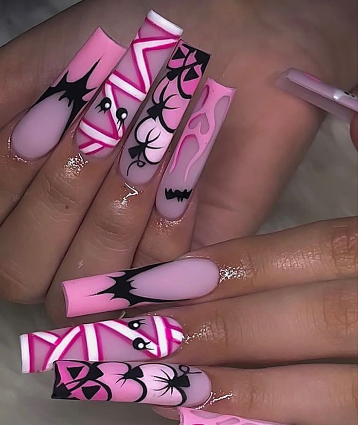 Halloween-Inspired Nail Art: Vibrant Pink and Black Design with Spooky Patterns