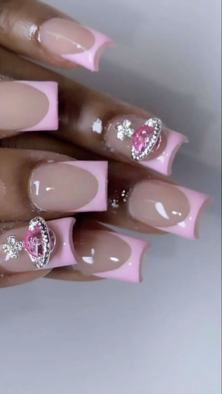 Chic Soft Pink and Nude Nail Design with Glossy Square Tips and Sparkling Accents.