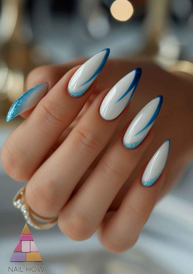 Stunning Almond-Shaped Nails: A Sophisticated Blend of White and Blue with Artistic Accents.