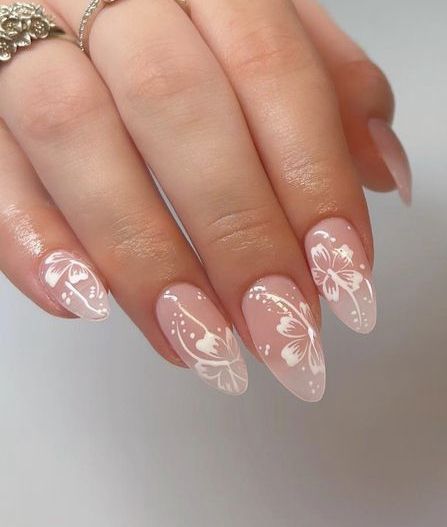 Whimsical Floral Nail Design with Elegant Butterfly Patterns and Pointed Tips