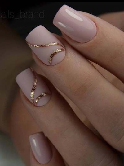 Chic Nude Nail Design with Delicate Gold Glitter Swirls for Modern Sophistication.