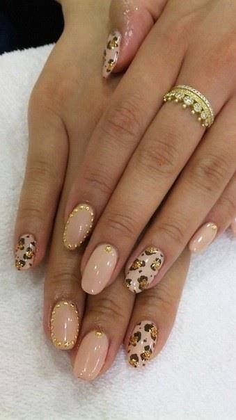 Chic Nude Leopard Print Nail Design with Glamorous Gold Accents