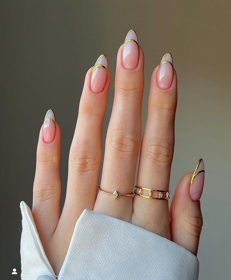 Sophisticated Elegant Nail Design with Soft Pink, Classic French Tips, and Gold Accents.