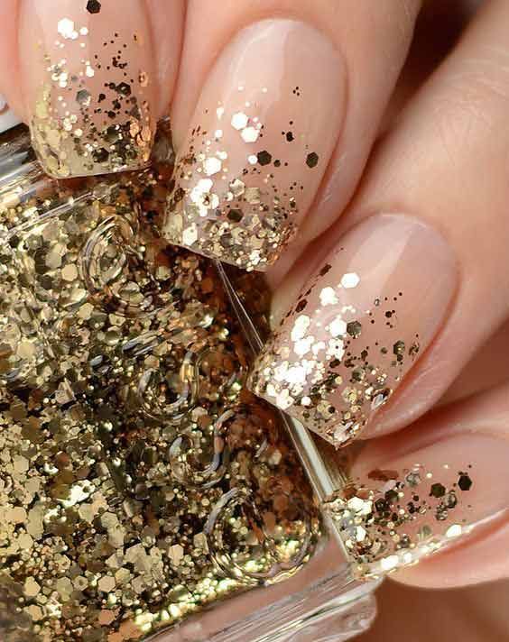 Elegant Glittery Ombre Nail Design with Sequin Tips.