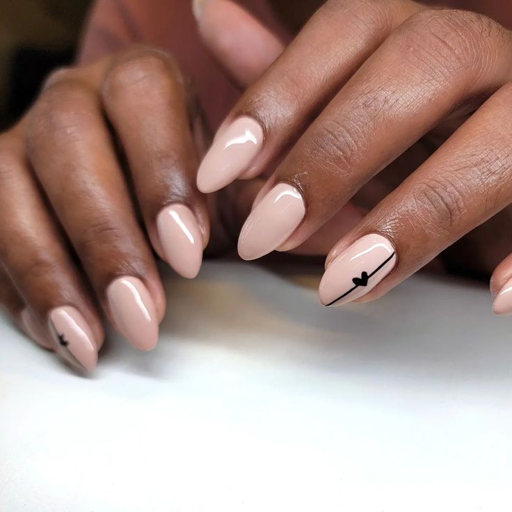 Sophisticated Almond-Shaped Nude Nails with Minimalist Black Line Art Accent.