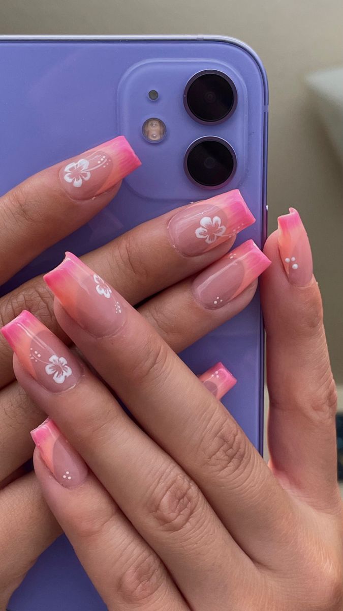 Dreamy Pink Gradient Nail Design with Floral Accents.