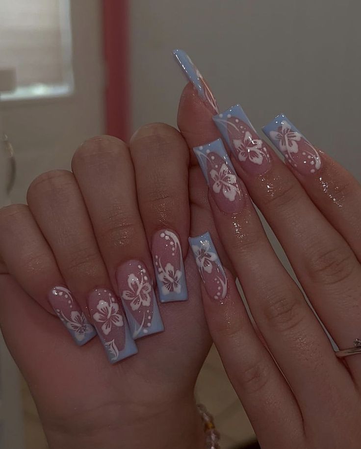 Pastel Floral Nail Design: Elegant Whimsy in Pink and Blue.