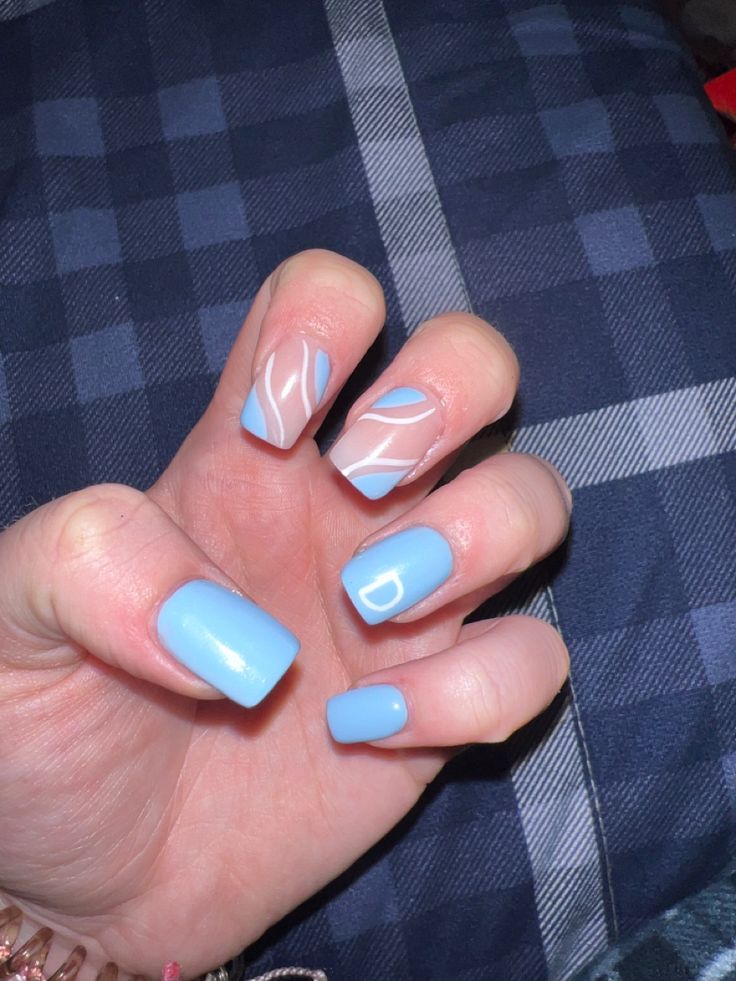 Chic Blue Nail Design: A Balanced Blend of Solid and Abstract Patterns