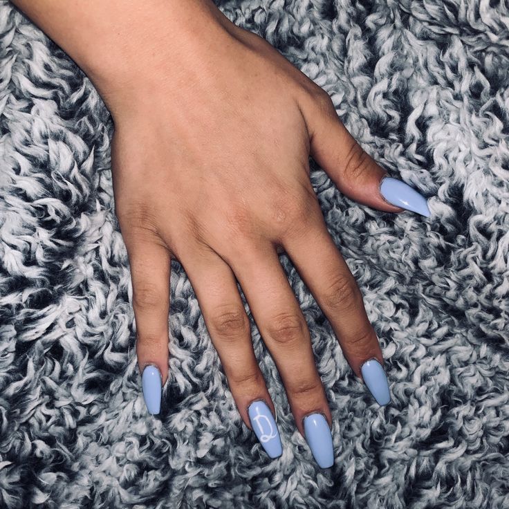 Elegant Pastel Blue Almond Nails with Unique Artistic Flair for Every Season.