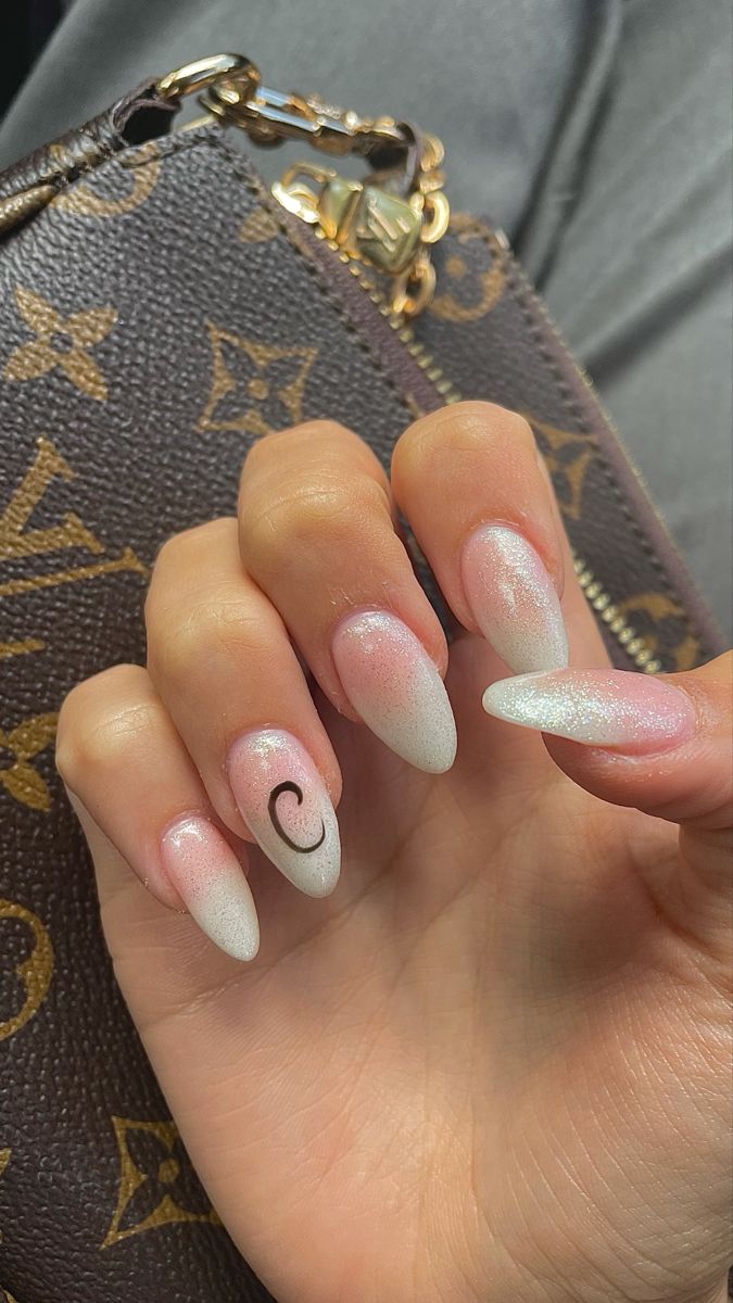 Sophisticated Almond-Shaped Ombre Nails with Sparkle and Artistic Personalization.