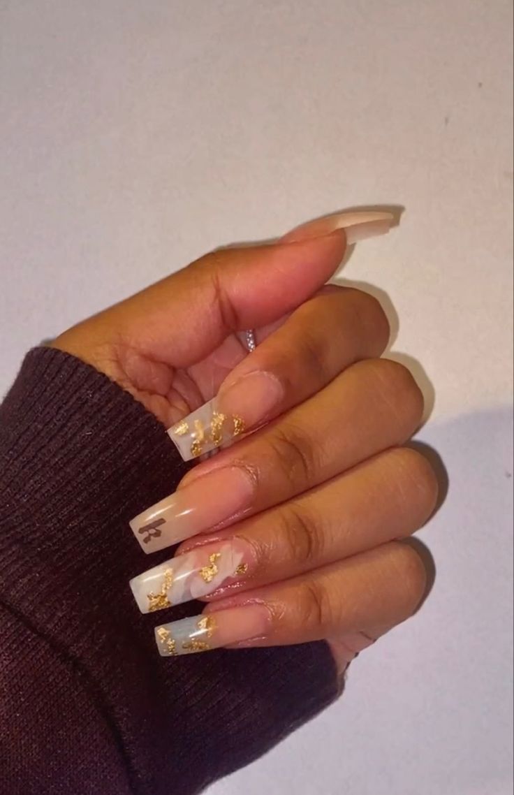 Elegant Nude Gradient Acrylic Nails with Gold Foil Accents in Chic Square Shape.