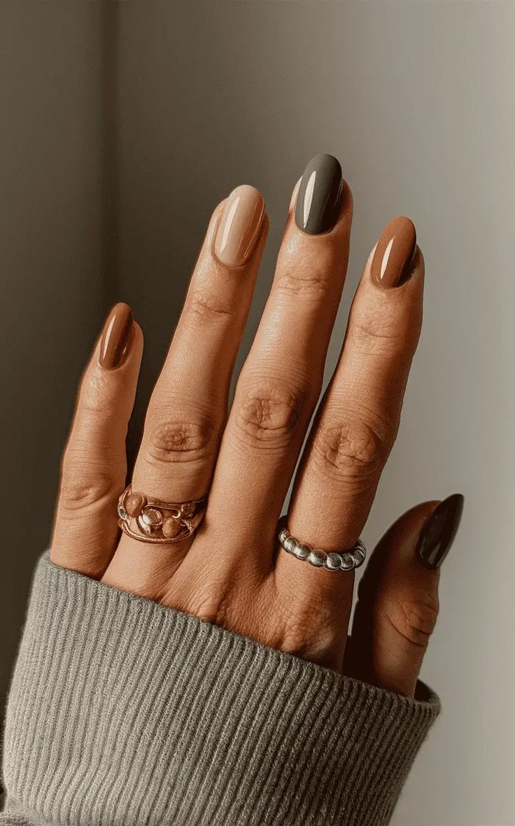 Chic Earth-Toned Nail Design with Glossy and Matte Finishes for a Trendy Look