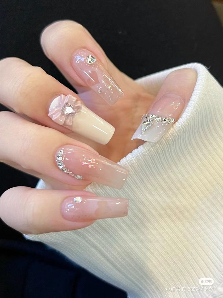 Chic Nail Design: Nude and Clear Finishes Adorned with Delicate Embellishments