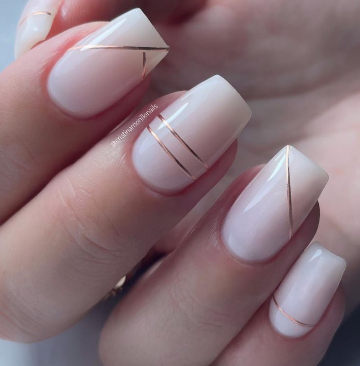 Chic Geometric Nail Design: Soft Nude Base with Delicate Gold Accents