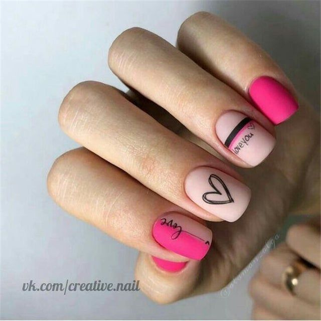 Playful Pink and Nude Nail Design with Geometric Shapes and Heart Motif.