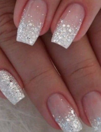 Chic Ombre Nails with Glittery White Tips and Glamorous Silver Accents.