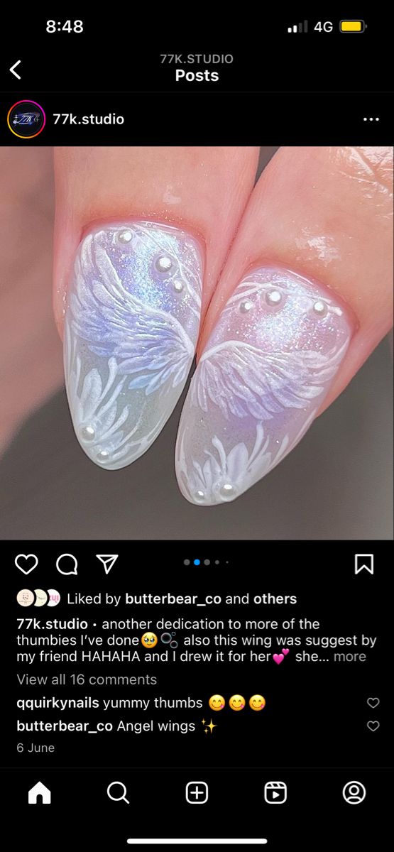 Ethereal Angel Wing Nail Art: Intricate Pastel Design with Pearl Accents