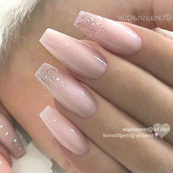 Sophisticated Almond-Shaped Pink Ombre Nails with Sparkling Gradient Tips.