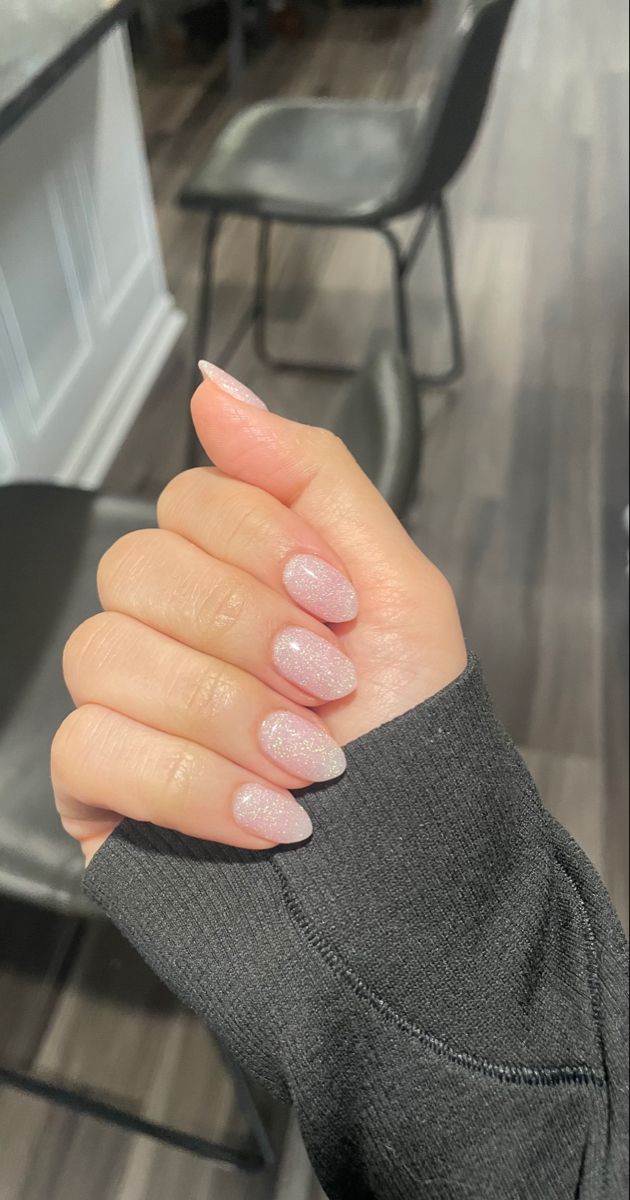 Elegant Soft Pink Glistening Nail Design with Almond-Shaped Tips