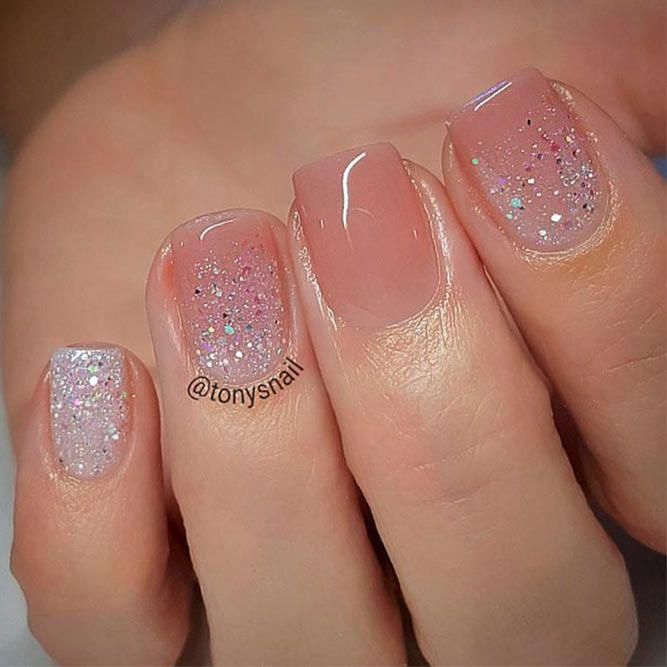 Chic Nude Nail Design with Delicate Glitter for Effortless Elegance.