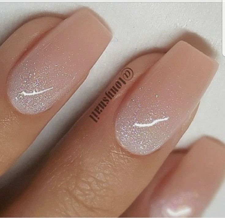 Sophisticated Gradient Nude Nails with Glitter Finish for Elegant Versatility.