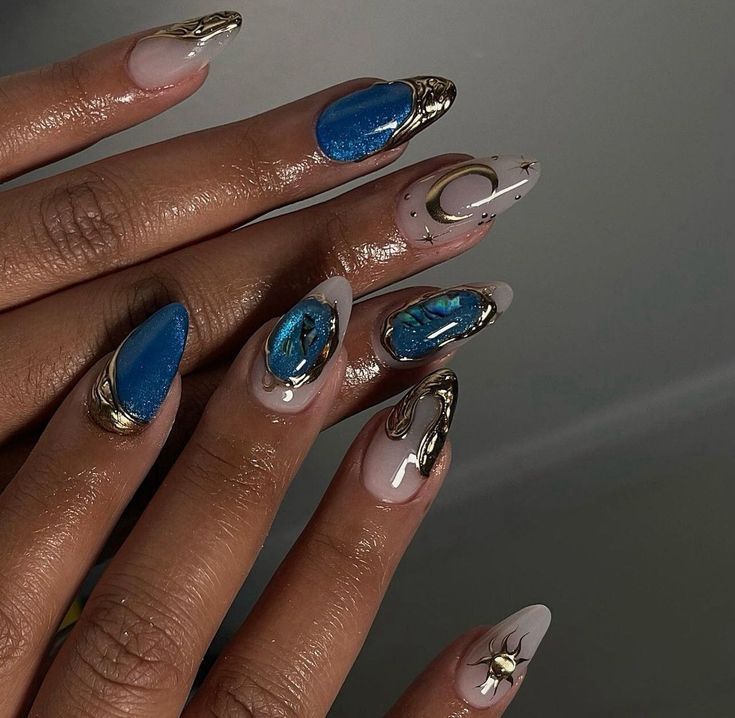 Artistic Nail Design: Glossy Finishes, Unique Shapes, and Textured Accents in Stunning Blue Hues.