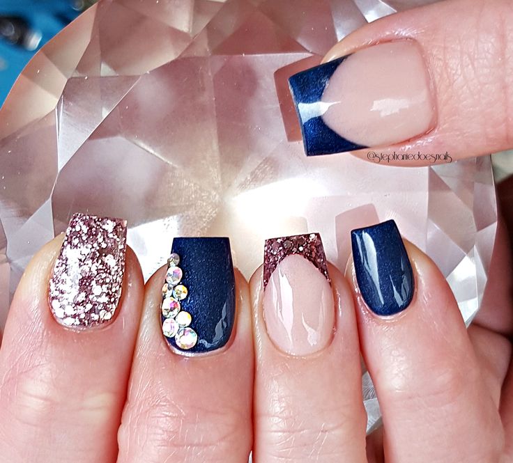 Chic Nail Design: Sparkling Glitter, Deep Navy Hues, and Iridescent Rhinestones for Glamorous Elegance.