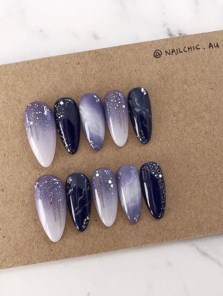 Celestial-Inspired Nail Design with Gradient Deep Purples and Glitter Accents