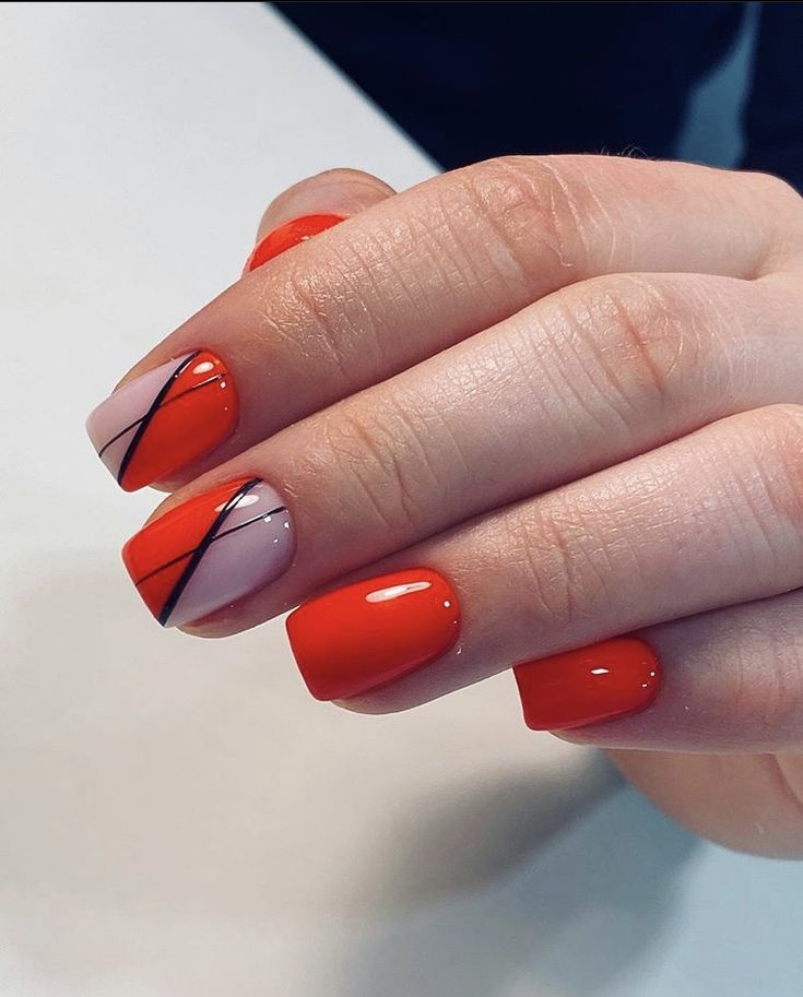 Chic Modern Nail Design: Vibrant Red and Soft Pink with Bold Diagonal Lines.